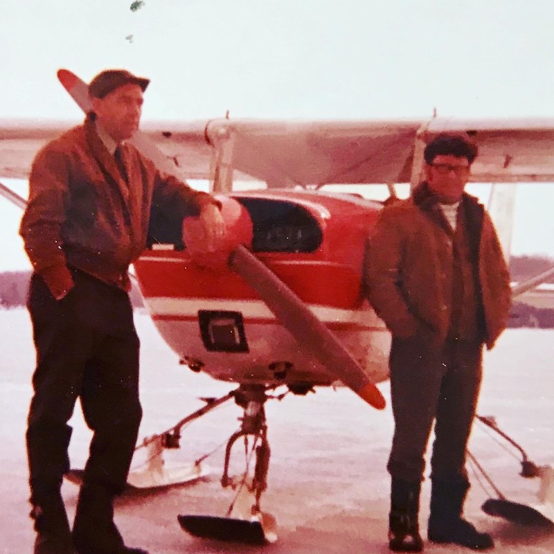 James Bird Cooper and Garry Elmer Lonsberry standing beside a Cessna 150